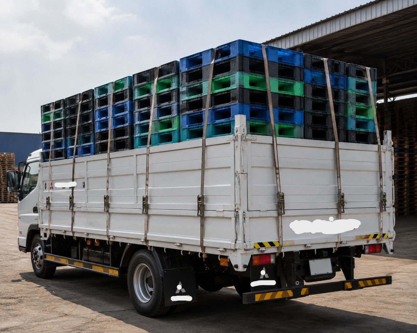 A truckload of new plastic pallets ready for delivery
